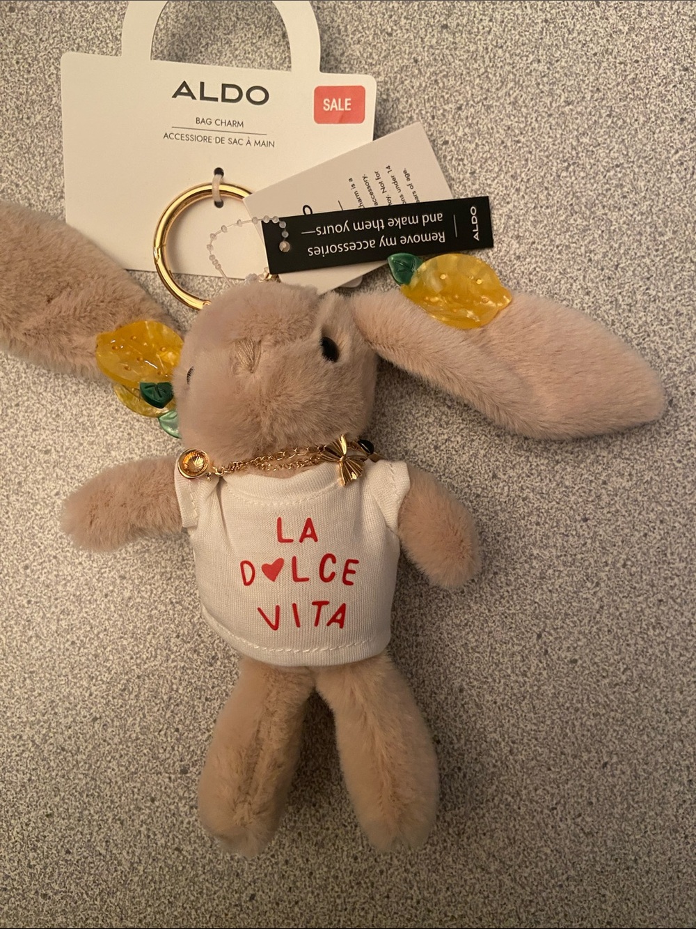 ALDO Beige Bunny Bag Charm with Yellow Leaf Accents